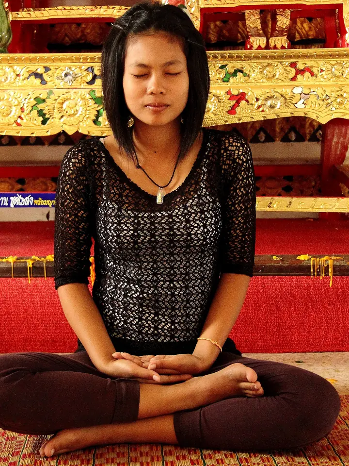 Sofia Lindqvist meditating cross-legged with eyes closed